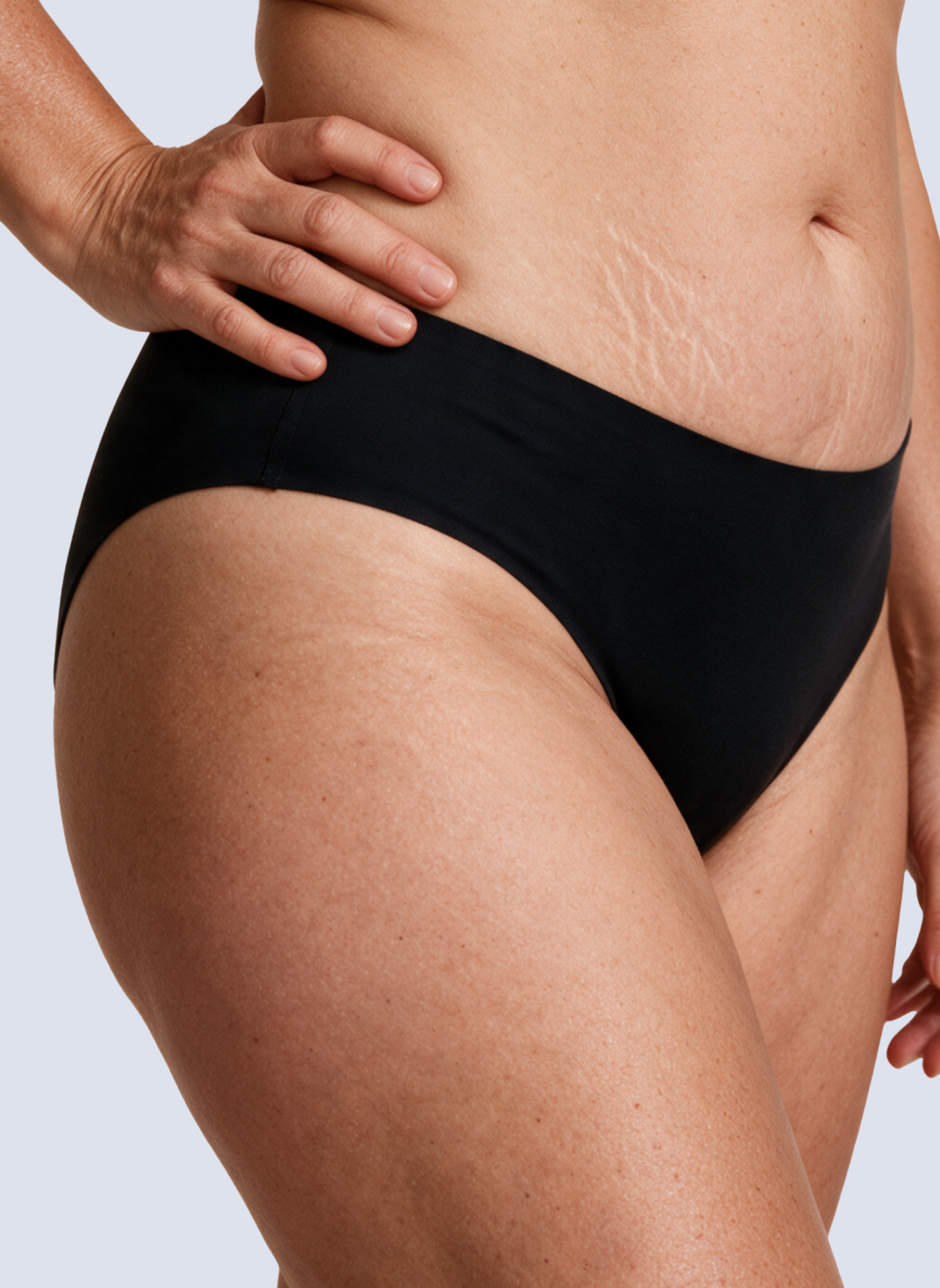 Black seamless mid rise knickers, side view