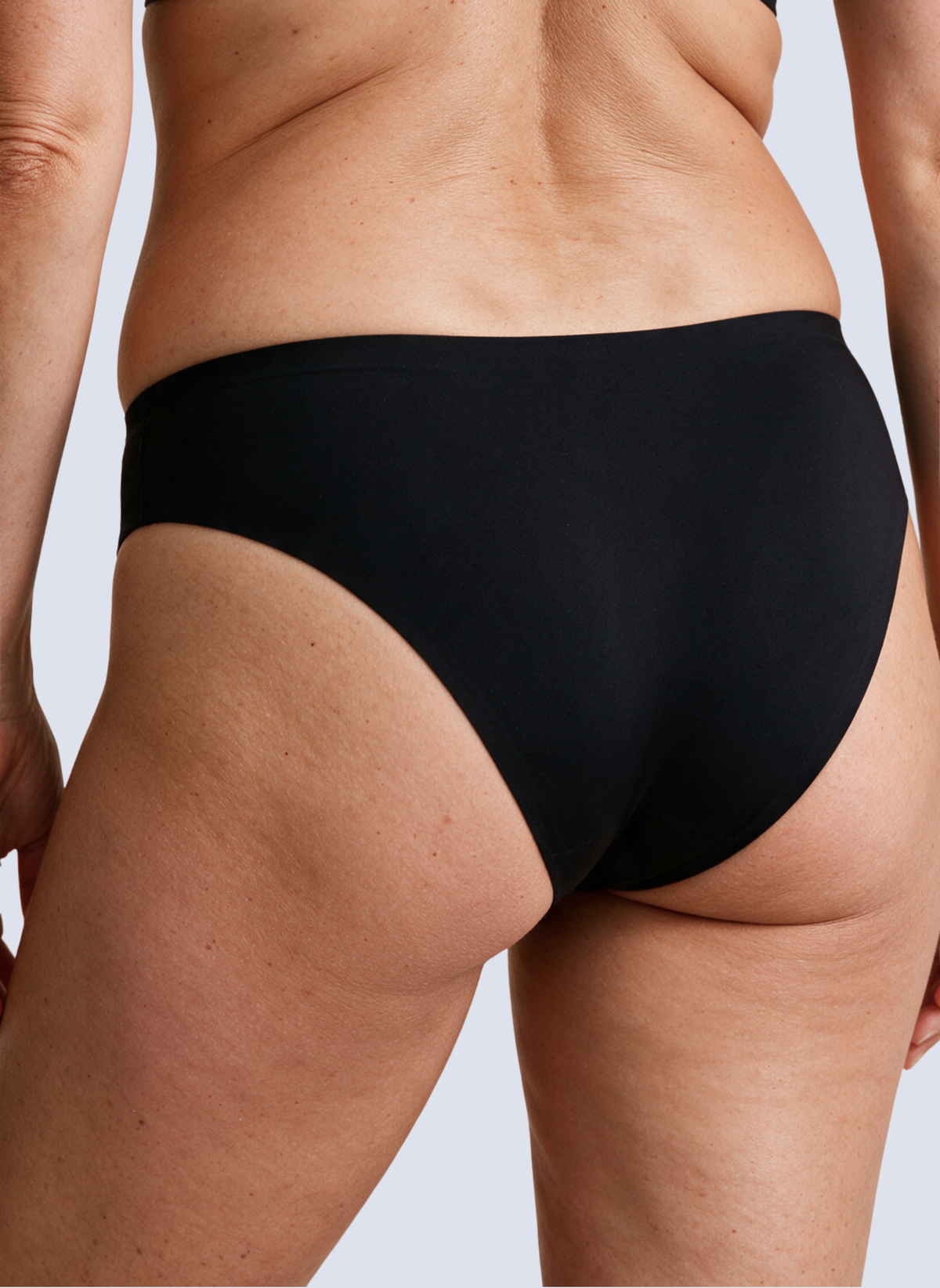 Black seamless mid rise knickers, back view