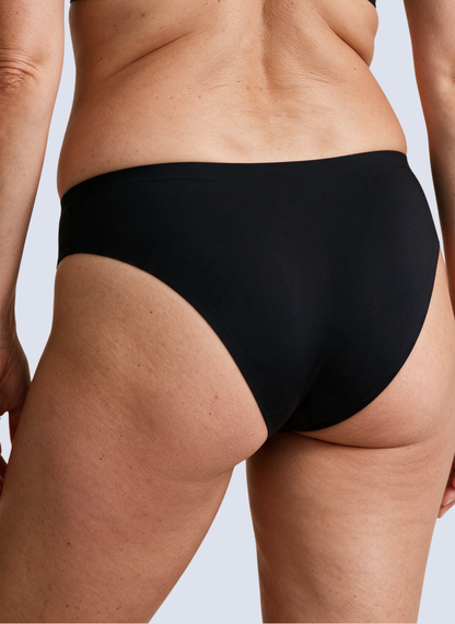 Black seamless mid rise knickers, back view