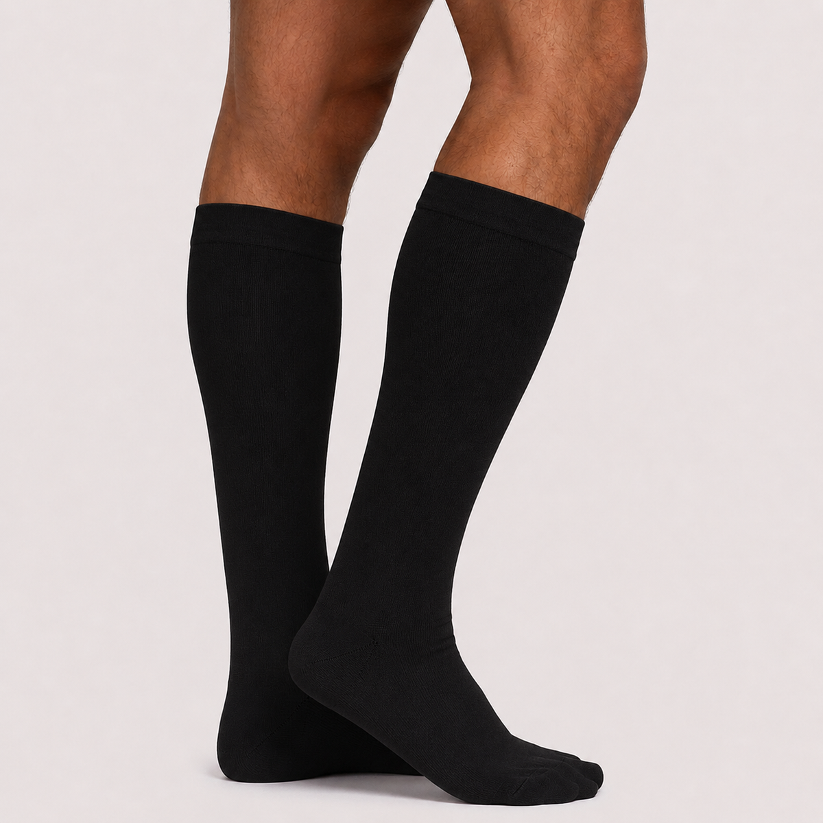 Black knee high compression socks with closed toe, side view