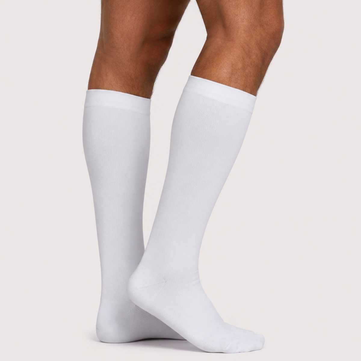 White knee high compression socks with closed toe, side view