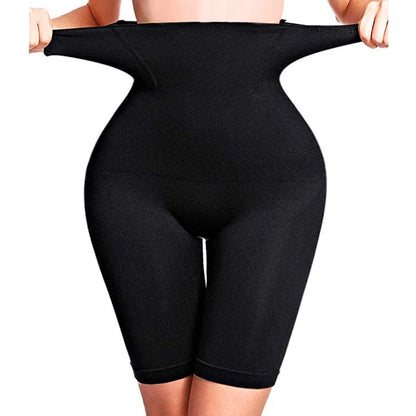 Black high waisted shapewear shorts worn, showing the stretch of the waistband