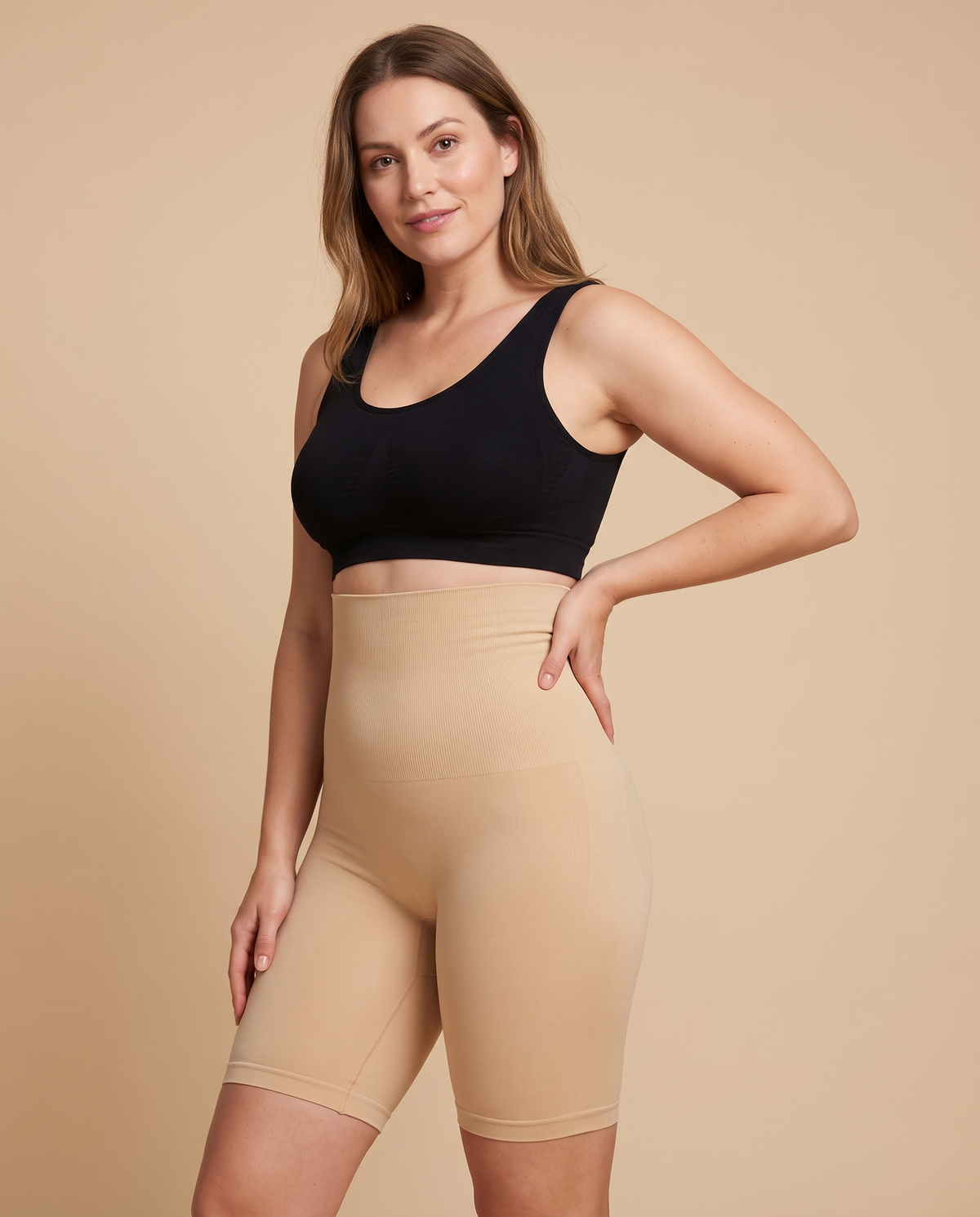 Woman wearing nude high waisted shapewear shorts that reach mid thigh