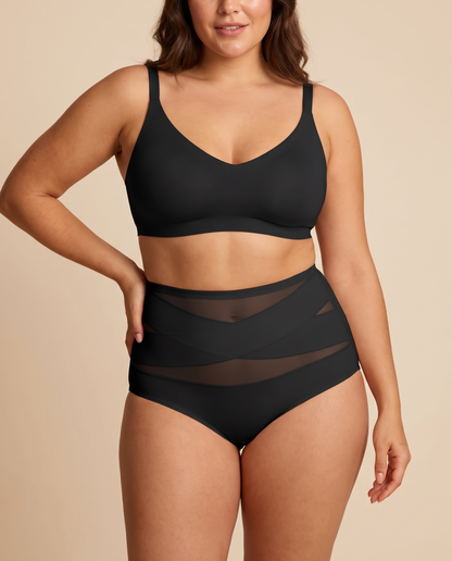Woman wearing black high waisted tummy control knickers with crossed mesh panels