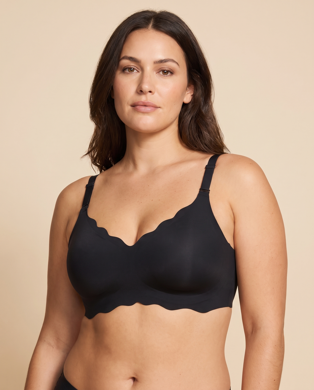 Black scalloped wireless full coverage bra worn by a model