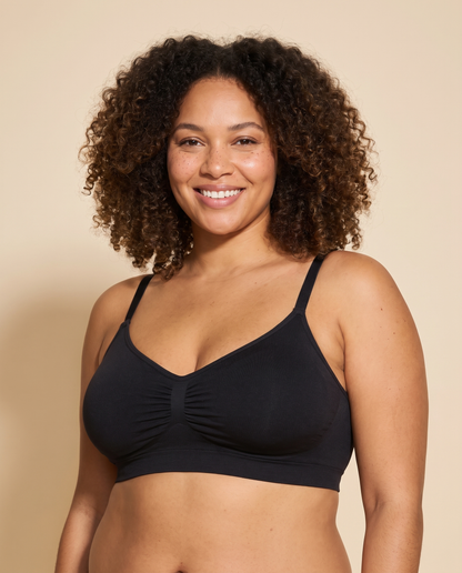 Woman wearing a black wireless ruched pullover bra
