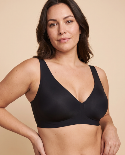 Black wireless deep V plunge bra worn by a model