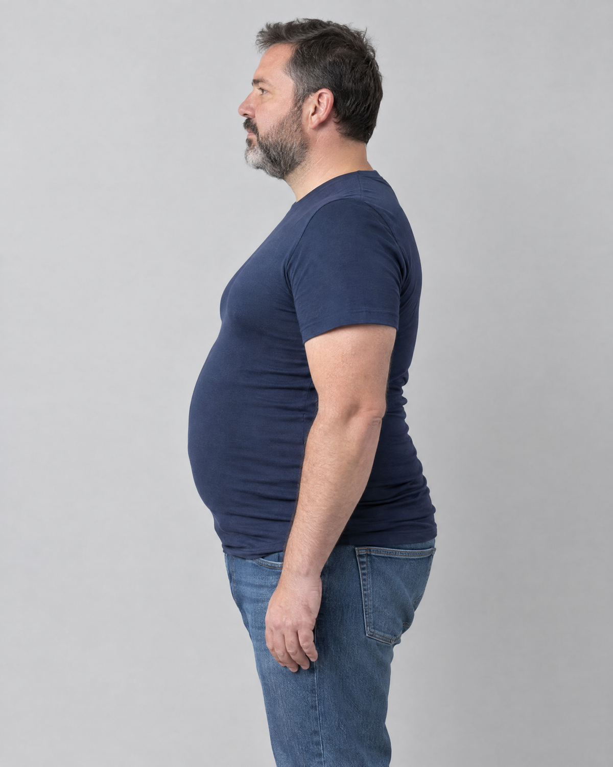 Without: man in a navy t-shirt, side view, no compression tank underneath