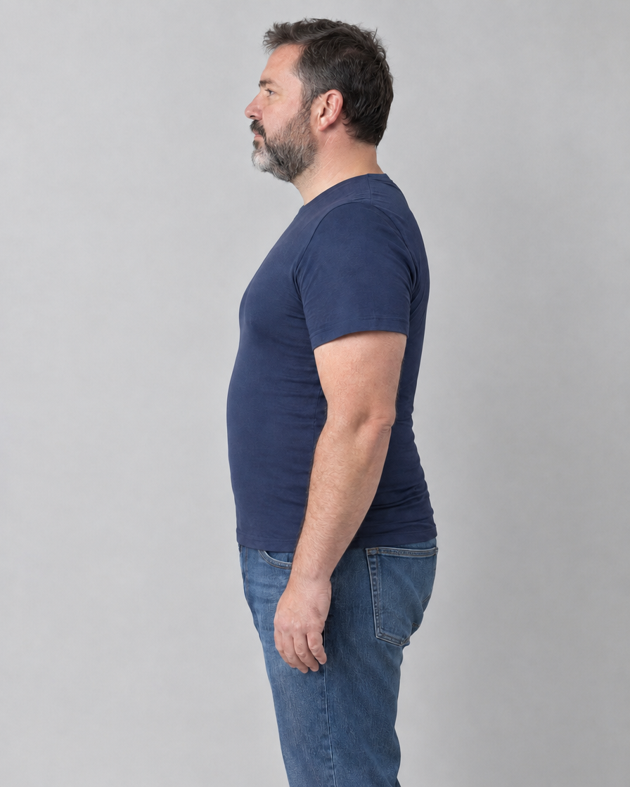 With: same man in the same navy t-shirt, side view, wearing the compression tank top underneath